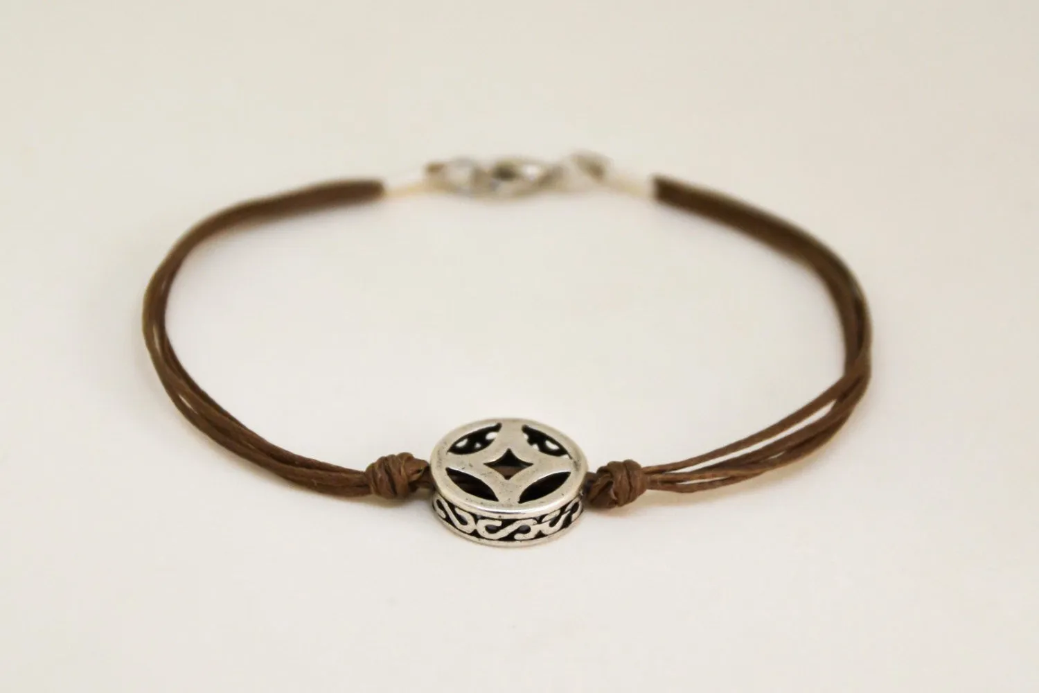 Silver circle bracelet for men, brown cord