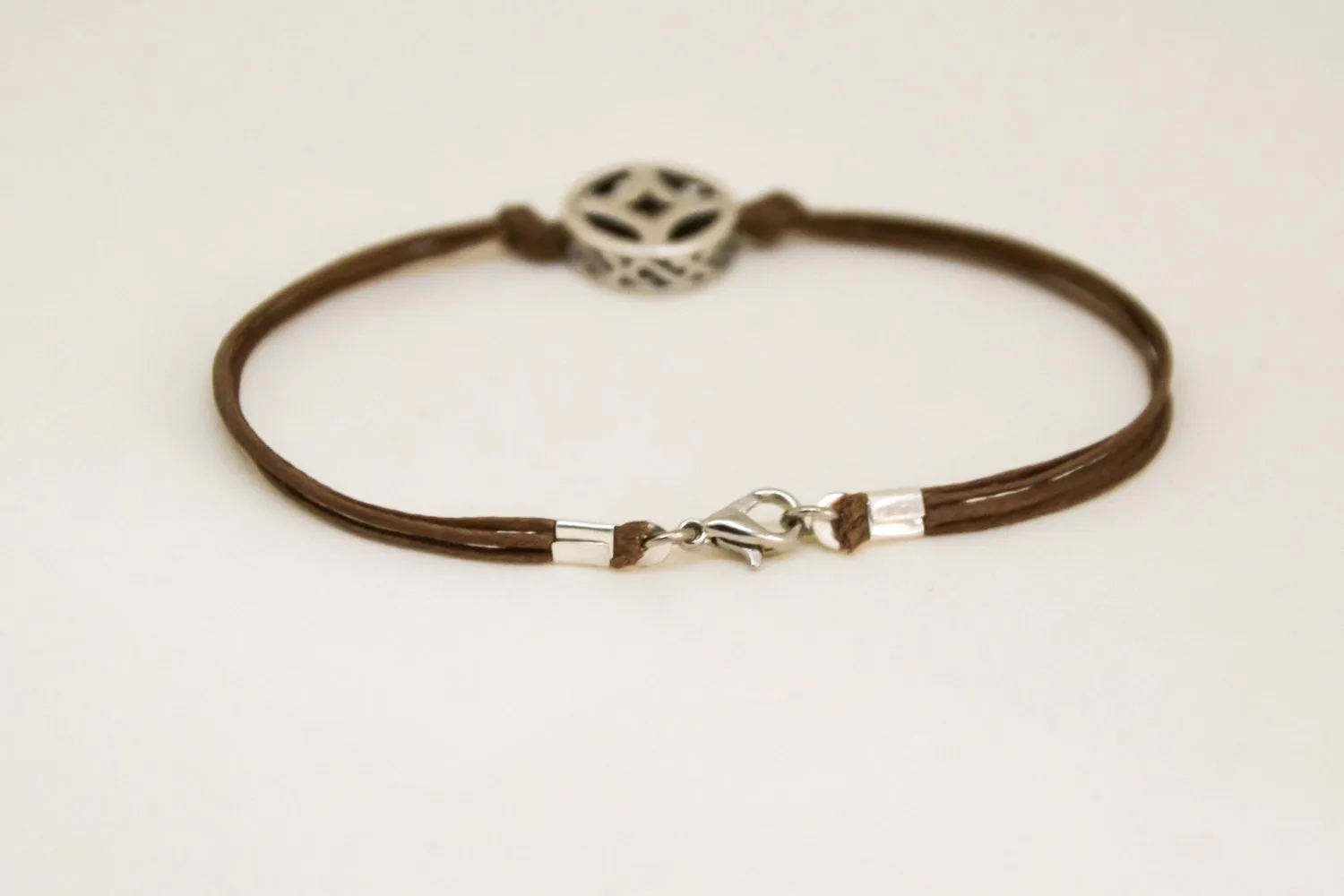 Silver circle bracelet for men, brown cord